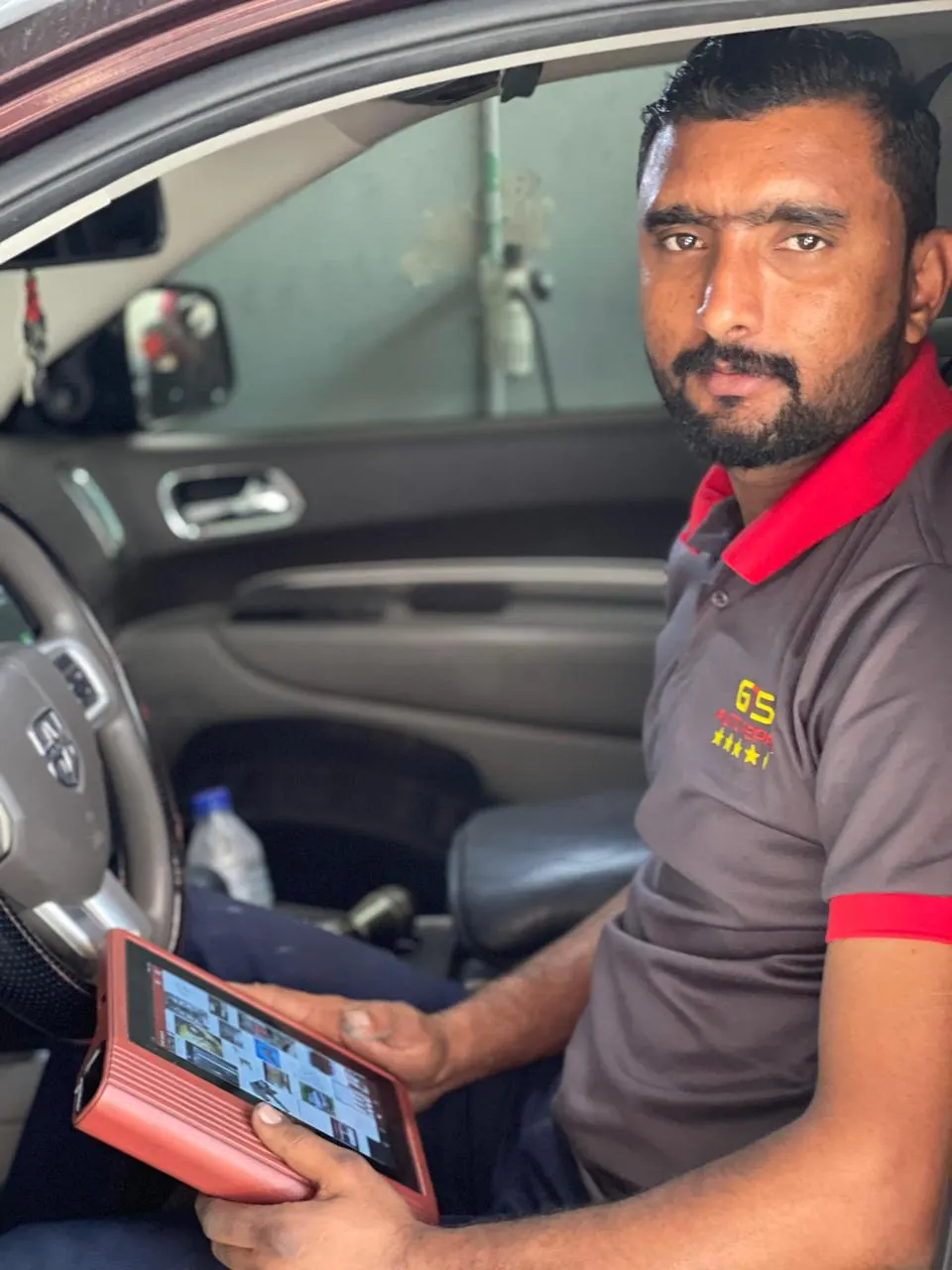 Diagnostic tablet check inside a customer vehicle